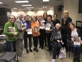 Book Club attendees including Celia Michaels-Evans, daughter of author Ruth Gruber, 4th from the left.