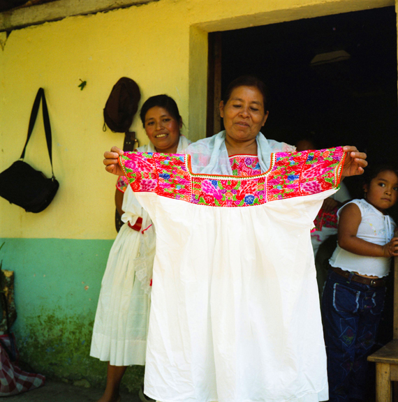 Joaquina Diego displaying her weavings from home, ©Mary Teresa Giancoli