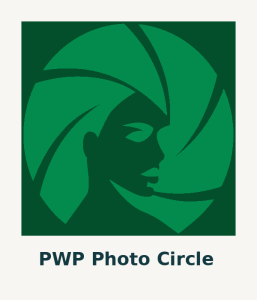 Logo for PWP Photo Circle featuring a stylized silhouette of a woman's face in profile. The face is integrated with a circular camera shutter design, symbolizing photography. The logo uses shades of green, with the darker silhouette contrasting against the lighter shutter blades
